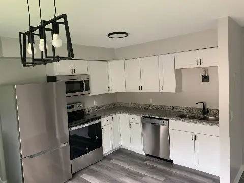 Contemporary kitchen with stainless steel appliances and granite countertops